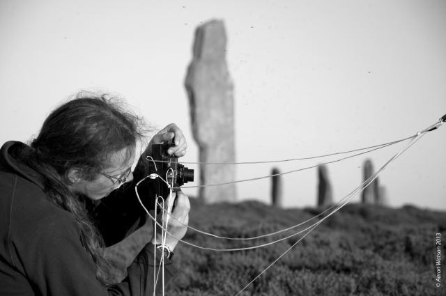 Kieran reviewing his kite photographs at the Ring of Brodgar.